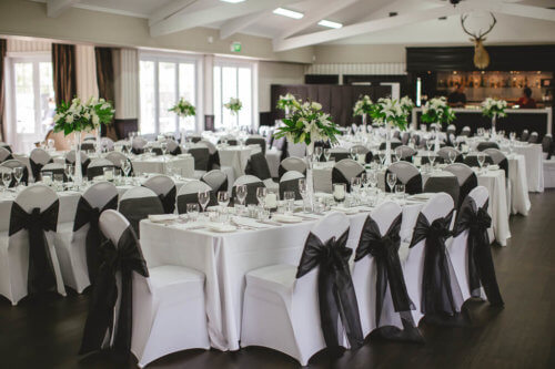 Wedding Decoration Hire, white chair covers with black sashes