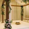 Wooden mandap side view with flowers