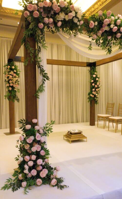 Wooden mandap side view with flowers