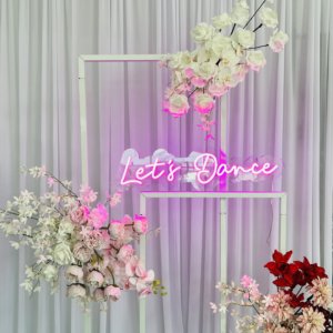 Lets dance neon sign in pink light