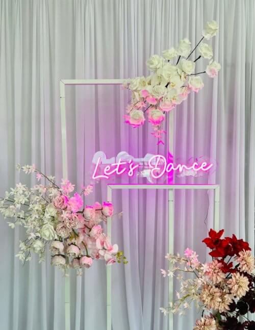 Lets dance LED neon sign in pink light