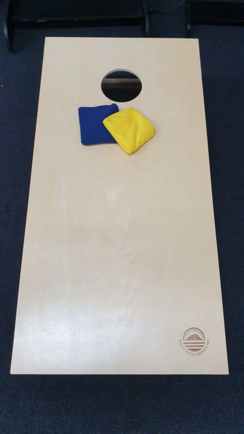 Corn Toss Game with yellow and blue bags to toss.